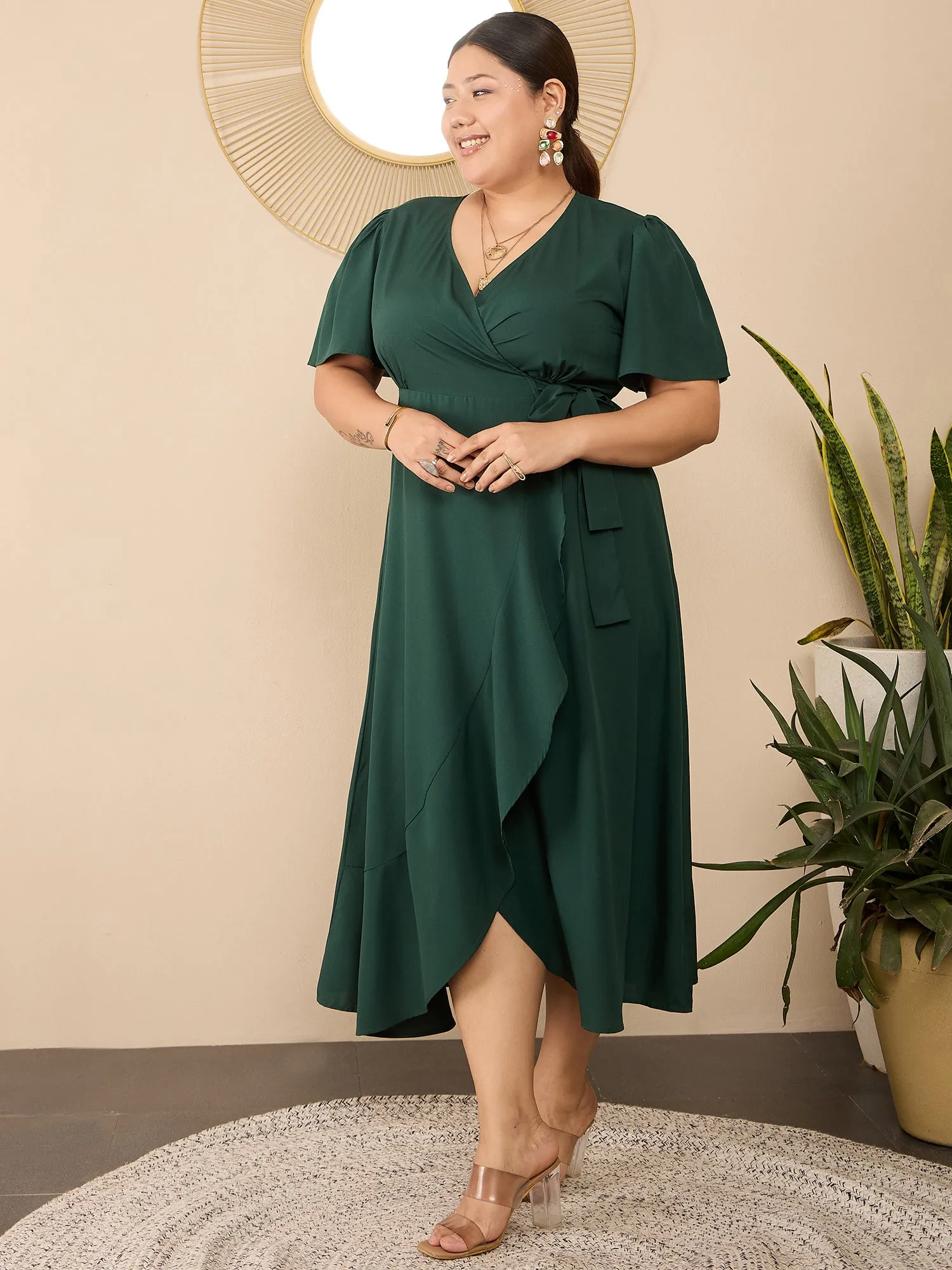 Berrylush Curve Women Solid Green V-Neck Flared Sleeves Tie-Up Waist Asymmetrical Hem Wrap Ruffled Maxi Dress